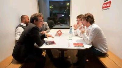 Entrepreneurs from Steady Fare, a website in the United States promising to lock-in airfares for its users in return for a small fee, chat with some of the attendees during Demo Day. Jaime Puebla / The National