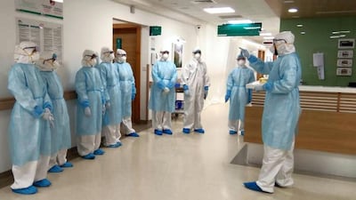 A team of medics gets ready to do their rounds at a 50-bed hospital in Sonapur in Dubai that has been reserved to treat moderate to critical Covid-19 patients