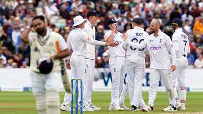 India's Rishabh Pant trudges off as England spinner Jack Leach celebrates taking the wicket with teammates. PA