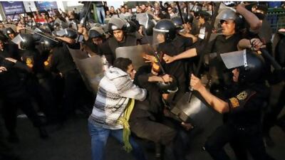 Demonstrators clash with police on January 25 in central Cairo during a protest to demand the departure of President Hosni Mubarak and calling for reforms, the start of two and a half weeks of uproar.