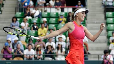 Caroline Wozniacki celebrates winning the Pan Pacific Open in Japan. Kiyoshi Ota / EPA