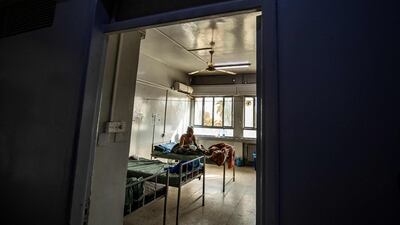 A patient suffering from burns at a hospital in the Kurdish-controlled city of Hasakeh after a fire tore through a wedding party at Al Hol displacement camp in Syria. AFP