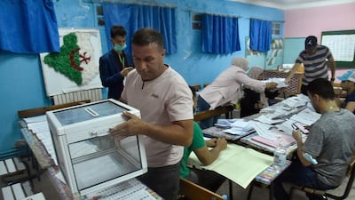 Algerian elections staff count ballots for parliamentary elections at a polling station in Bouchaoui, on the western outskirts of the capital Algiers. AFP