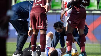 Kylian Mbappe is attended by medics. AFP