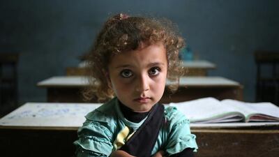 A Syrian refugee girl sits in a classroom in Lebanon. (Hussein Malla / AP)