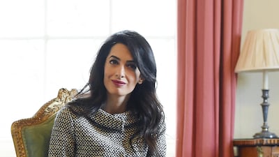 Amal Clooney, in a woollen skirt suit, meets with former president of Maldives Mohamed Nasheed and former British prime minister David Cameron in London on January 23, 2016. EPA