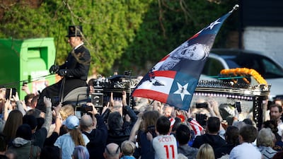 Fans gather for British singer Keith Flint of techno group The Prodigy funeral in Braintree, Essex in England on Friday, March 29. REUTERS
