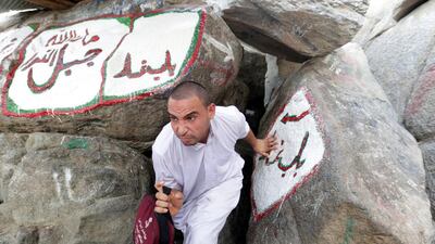 A pilgrim heads out of the Hira grotto where Prophet Mohammed is believed to have received the first verses of Quran from the Angel Jibril (Gabriel), in Mecca, Saudi Arabia. Amel Pain / EPA