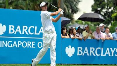 Adam Scott tees off at the Barclays Singapore Open.