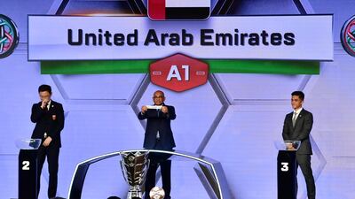 AFC general secretary Dato' Windsor John displays the slip of the UAE during the draw for the 2019 Asian Cup. Giuseppe Cacace / AFP