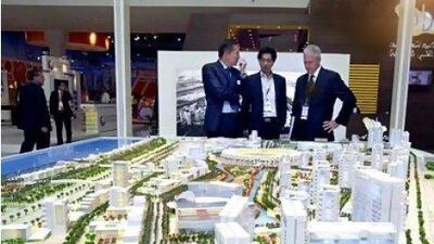 TDIC is master developer of the Saadiyat Island development. Above, visitors look at models of planned projects in the island.