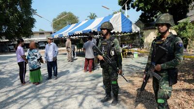 Thai soldiers stand guard near a polling station in Narathiwat. AFP