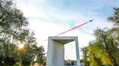 A plane flies over the Founder's Memorial in Abu Dhabi, celebrating the 51st National Day. Wam