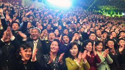 North Koreans react as they watch a joint performance by South and North Korean musicians. AFP / Korea Pool