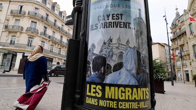 Anti-migrant posters in Beziers in the centre of Beziers sparked outrage among rights groups after the local mayor called for a local referendum ahead of the arrival of asylum seekers in his town. Pascal Guyot/AFP