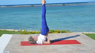 Tao Porchon-Lynch in Shoulder Stand in Montego Bay, Jamaica. Photo by Teresa Kay-Aba Kennedy
