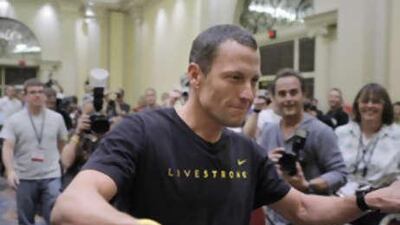 Cyclist Lance Armstrong arrives for a news conference at the annual Interbike International Bicycle Expo in Las Vegas, Thursday, Sept 25, 2008.