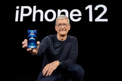 Apple chief executive Tim Cook with the all-new iPhone 12 Pro during a special event at Apple Park in Cupertino in October last year. EPA