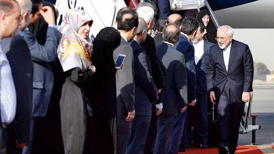 Iranian foreign minister Mohammad Javad Zarif (R) greets Iranian officials as he and members of his negotiation team arrive at the Mehrabad airport in Tehran on July 15, 2015. Abedin Taherkenareh/EPA