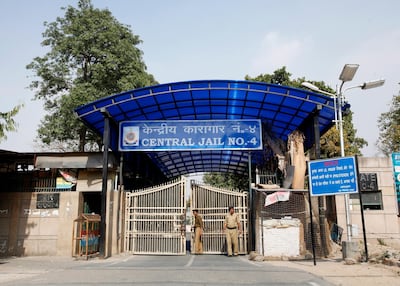 Police stand guard at one of the gates of the Tihar Jail in 2013. Reuters.