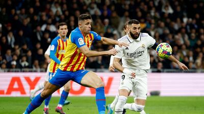 Real Madrid's Karim Benzema in action with Valencia's Gabriel Paulista during the La Liga match at the Bernabeu on February 2, 2023. Real Madrid won the match 2-0, with Paulista later sent off. Reuters