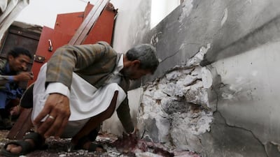 People inspect damage caused by a bomb explosion at a mosque in Yemen's capital Sanaa on May 22. Reuters