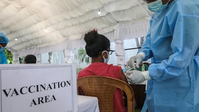 An army medical worker in Colombo, Sri Lanka, vaccinates staff working in the education sector with the Sinopharm shot.