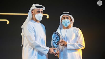 Sheikh Theyab bin Mohamed, Member of the Executive Council, presents the Asian Jiu-Jitsu Player of the Year Award to Zayed Al Katheeri. Photo: Abu Dhabi Government Media Office
