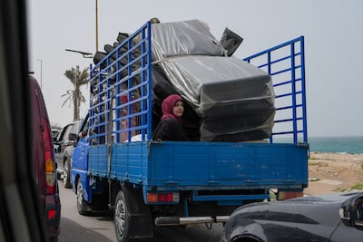 People travel south with their belongings on Saida Highway from Beirut to southern Lebanon. Getty Images