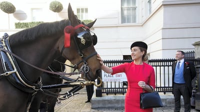 His Excellency Mansoor Abulhoul following his visit with Her Majesty The Queen at Buckingham Palace for the presentation of diplomatic credentials. Seen here with his wife in red with black hat, Victoria Devin and the Assistant Marshal of the Diplomatic corps with feathers in hat; outside the Lanesborough Hotel in central London where the reception HE Mansoor Abdulhoul's Vin d'honneur took place