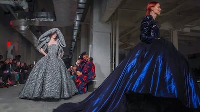 In the bowels of the Empire State Building, on a bare concrete floor, Siriano rolled out his huge, signature ball gowns. AP