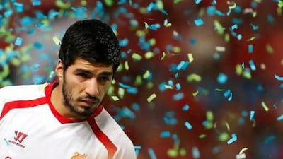 Liverpool’s Luis Suarez cut a surly figure at the trophy celebration yesterday.