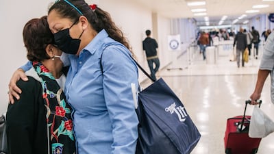 People wearing masks at George Bush Intercontinental Airport in Houston, Texas. AFP