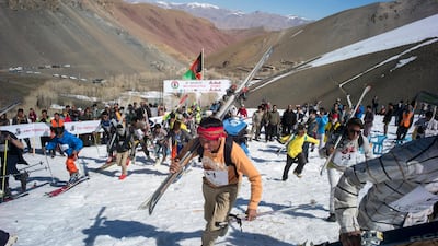 Participants make their way up the mountain after the start of the 2021 Afghan Mountain Challenge. Rick Findler for The National