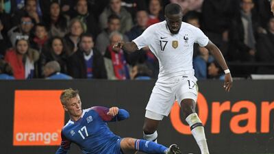 Iceland's forward Albert Gudmundsson (L) vies with France's midfielder Tanguy Ndombele during the friendly football match between France and Iceland at the Roudourou stadium in Guingamp, western France. AFP