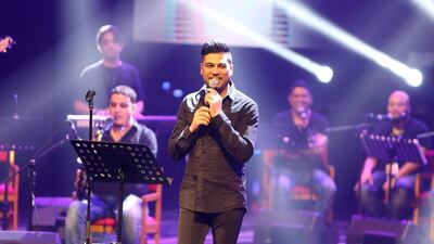 Waleed Al Shami performs during the Eid concert at Al Raha Beach Theatre in Abu Dhabi. Pawan Singh / The National