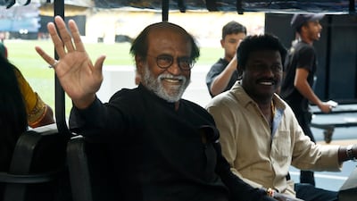 Indian movie superstar Rajinikanth, left, waves to his fans as he arrives at an event in Malaysia earlier this month. AP