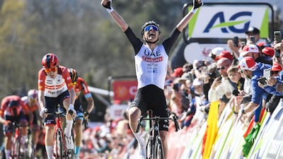 Slovenian Tadej Pogacar of UAE Team Emirates celebrates as he crosses the finish line to win the 86th edition of the men's race "La Fleche Wallonne", a one day cycling race (Waalse Pijl - Walloon Arrow), 194,2 km from Herve to Huy, in Belgium, on April 19, 2023 (Photo by GOYVAERTS / BELGA / AFP) / Belgium OUT