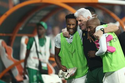 South Africa's coach Hugo Broos celebrates with Themba Zwane, left. and Khuliso Johnson Mudau after their Africa Cup of Nations quarter-final win against Cape Verde. AFP