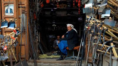 A vendor waits for customers at a market in Sana'a's old quarter in Yemen. AFP