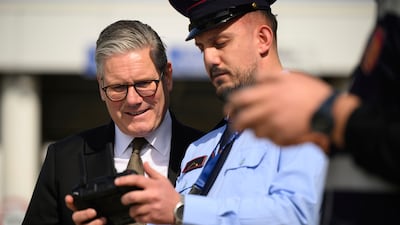 Britain's Prime Minister Keir Starmer speaks with a drone operator at the ferry port in Tirana, Albania. AP
