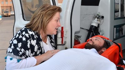 US Ambassador to Oman, Greta Holtz talking to American journalist, Casey Coombs, who had been held captive in Yemen, after arriving in Muscat. EPA