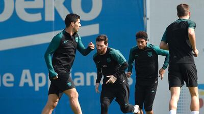 Luis Suarez,Lionel Messi, Neymar and Gerard Pique take part in a training session. Lluis Gene / AFP
