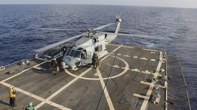 A US Navy SH-60R Seahawk helicopter lands on the destroyer USS Pinckney in the Gulf of Thailand. US Navy / Handout via Reuters March 11
