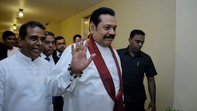 Mahinda Rajapaksa arrives for a meeting with supporting MPs at the parliamentary complex in Colombo on November 29, 2018. AP Photo