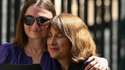 Rachel Reeves, left, Britain's Chancellor of the Exchequer, is comforted after Mr Starmer's departure. AFP