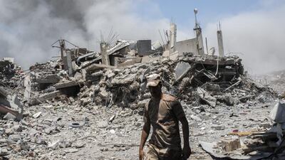 An Iraqi Army soldier walks past a destroyed building after an Iraqi forces airstrike targeted an Islamic State sniper position in Al Shifa, the last district of west Mosul, under Islamic State control. Martyn Aim / Getty Images