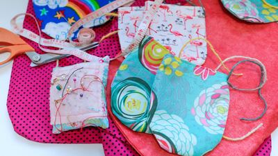 A selection of the colourful mittens ready to be shipped to Australia. Victor Besa / The National