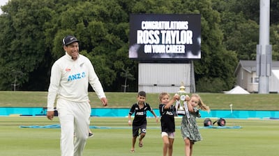 Ross Taylor walks off the pitch for the last time in a Test match with his children after New Zealand defeated Bangladesh in Christchurch on Monday, January 11. AFP