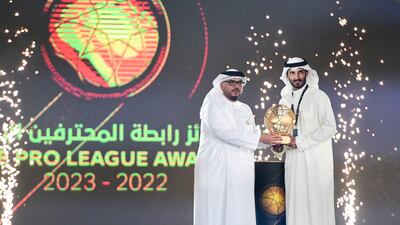 The Golden Ball award for best Emirati player is handed to Ali Mabkhout, right, at the UAE Pro League Awards. Khushnum Bhandari / The National